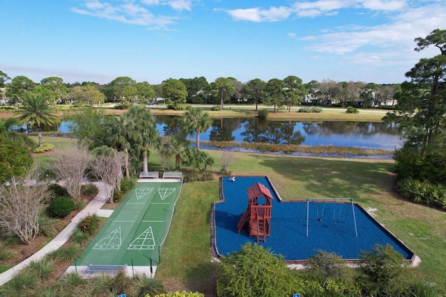 view of community with shuffleboard, a yard, and a water view