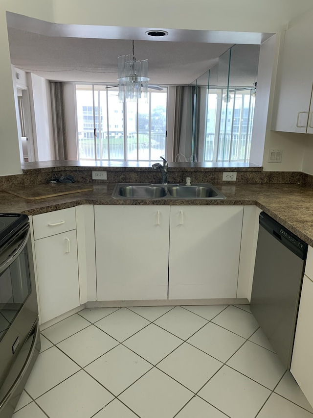 kitchen featuring range with electric stovetop, a wealth of natural light, white cabinetry, dishwasher, and sink