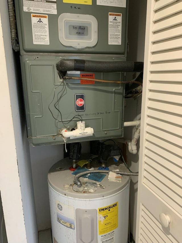 utility room featuring electric water heater