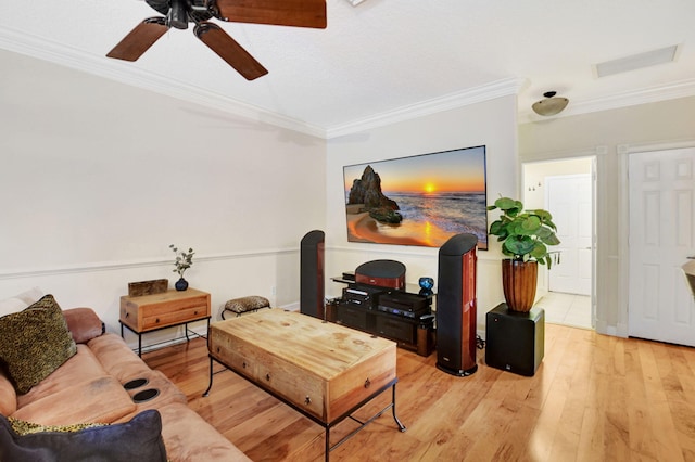 living room with ceiling fan, light hardwood / wood-style floors, and ornamental molding