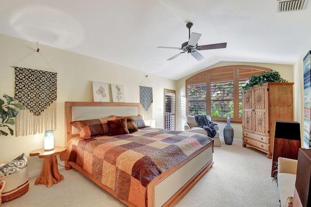 carpeted bedroom with vaulted ceiling and ceiling fan