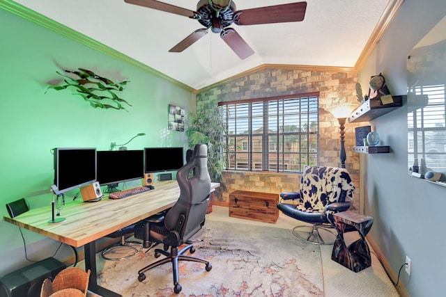 carpeted office space with ceiling fan, lofted ceiling, and crown molding