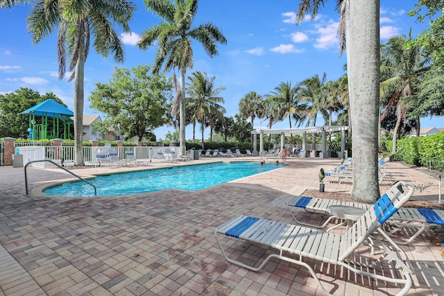 view of swimming pool with a pergola and a patio