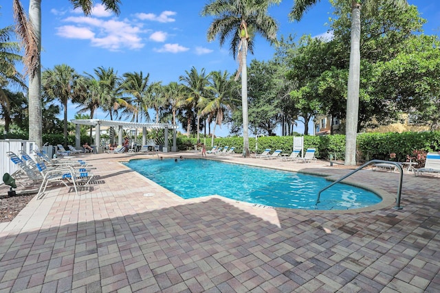 view of swimming pool with a pergola and a patio area