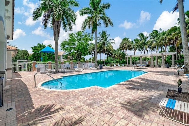 view of pool with a pergola and a patio area