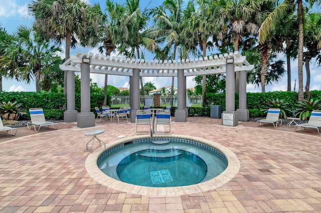 view of pool featuring a patio, a pergola, and a hot tub