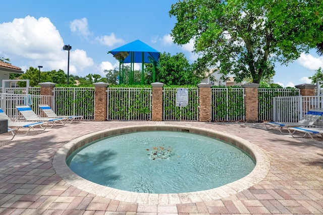 view of swimming pool with a patio