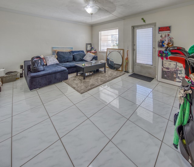 living room with ceiling fan and ornamental molding