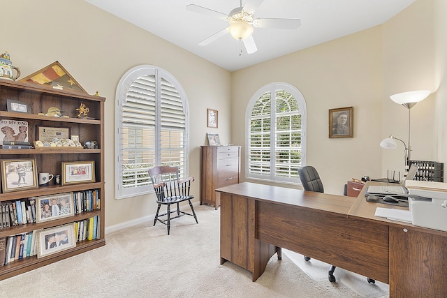 home office with ceiling fan and light colored carpet