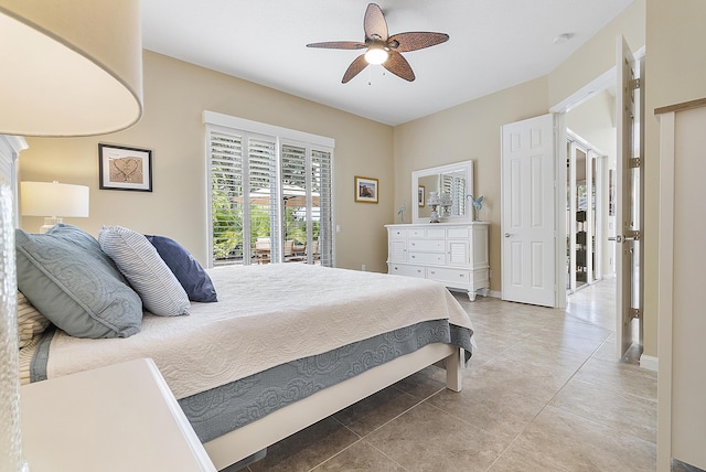 bedroom with light tile patterned floors, access to outside, and ceiling fan