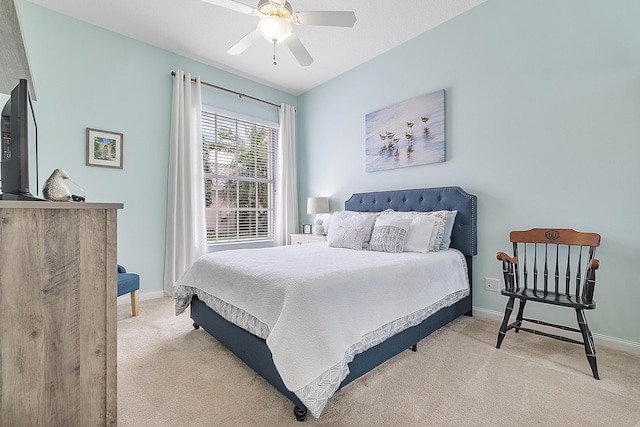 bedroom featuring light colored carpet and ceiling fan