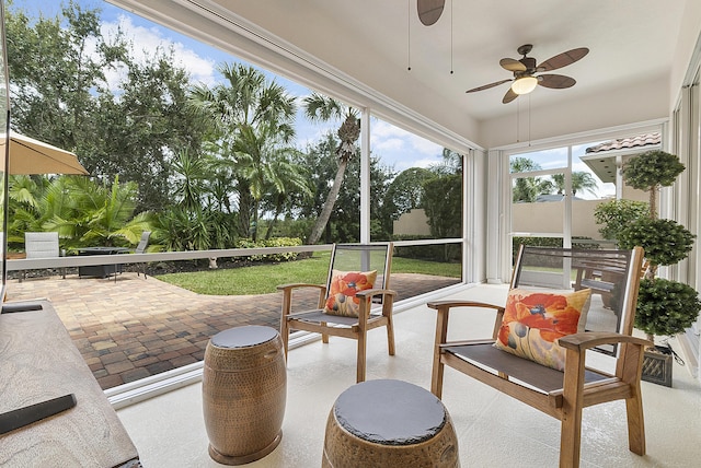 sunroom / solarium with ceiling fan