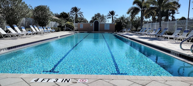 view of swimming pool with a patio area