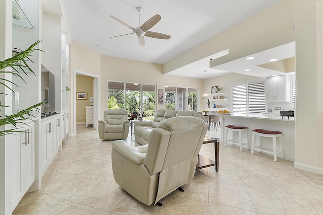 living room with light tile patterned floors and ceiling fan