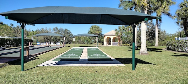 view of property's community featuring a lawn and a gazebo