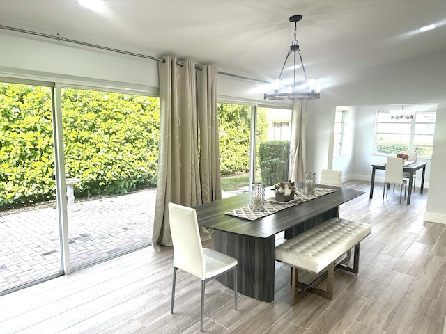 dining room featuring a chandelier and wood-type flooring