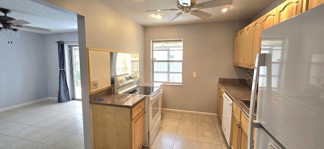 kitchen with white appliances, ceiling fan, and light tile patterned flooring