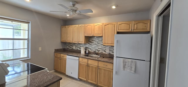 kitchen featuring ceiling fan, sink, tasteful backsplash, white appliances, and light tile patterned floors