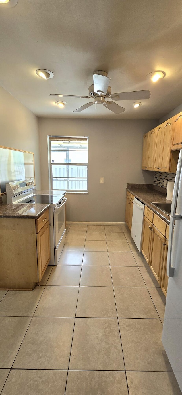 kitchen featuring ceiling fan, backsplash, white appliances, light brown cabinetry, and light tile patterned floors