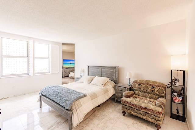 bedroom featuring a textured ceiling