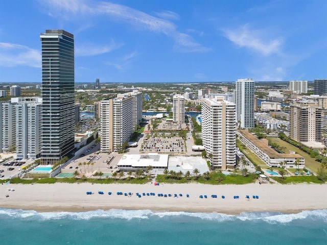 bird's eye view featuring a view of the beach and a water view