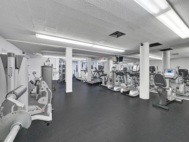 workout area with a textured ceiling