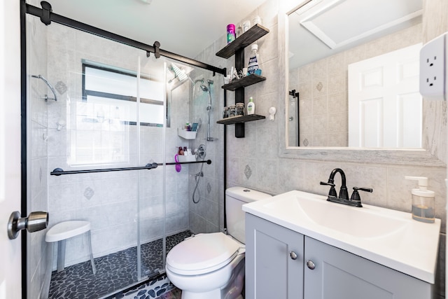 bathroom featuring backsplash, an enclosed shower, vanity, tile walls, and toilet