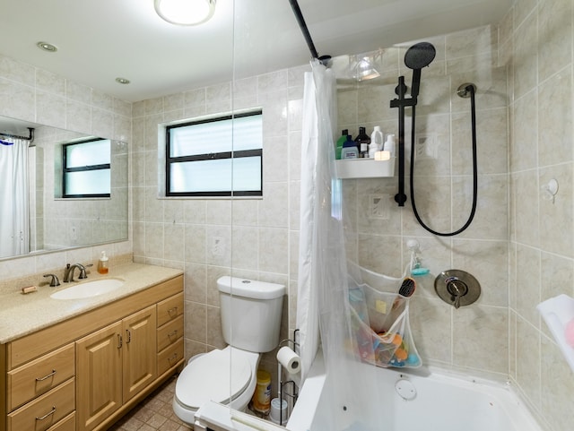 full bathroom with vanity, tile patterned flooring, toilet, shower / bathtub combination with curtain, and tile walls