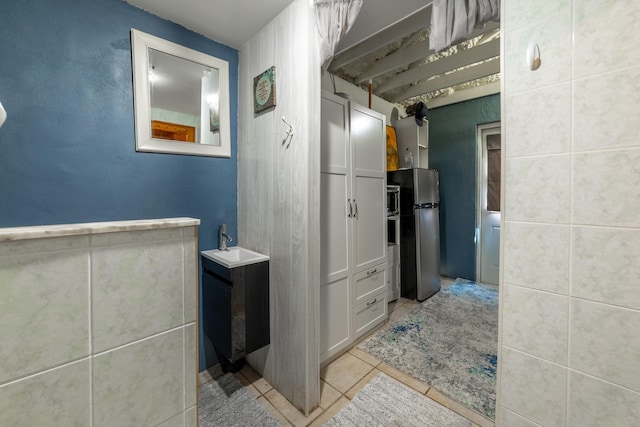 bathroom with tile patterned flooring and sink