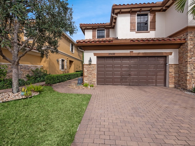 mediterranean / spanish house with a garage