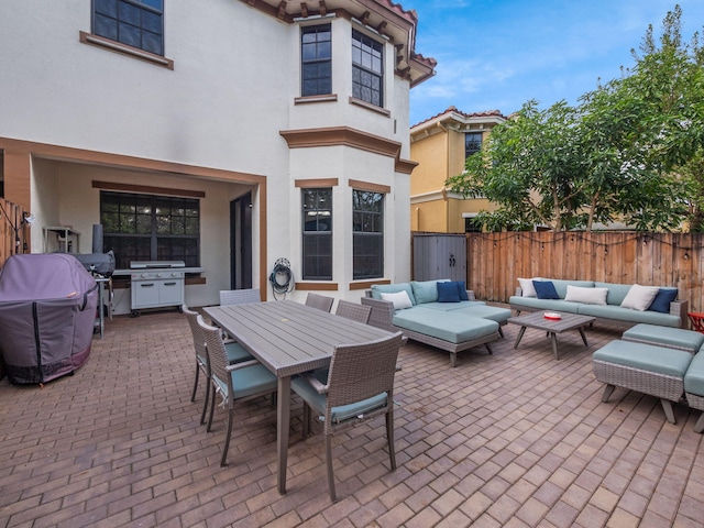 view of patio / terrace featuring outdoor lounge area and a grill