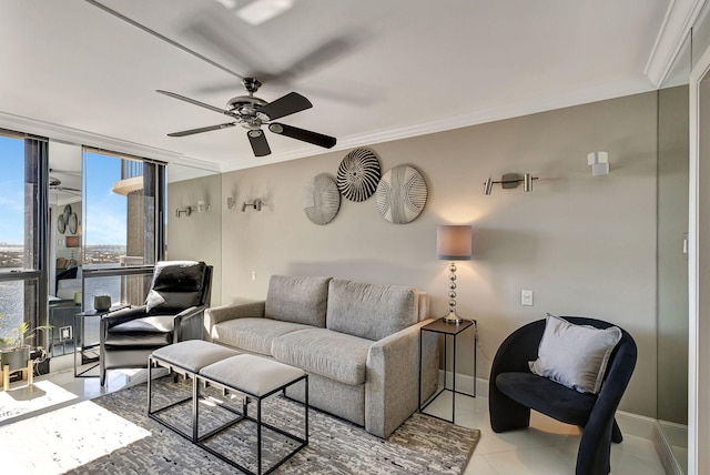 living room with ceiling fan, expansive windows, ornamental molding, and light tile patterned floors