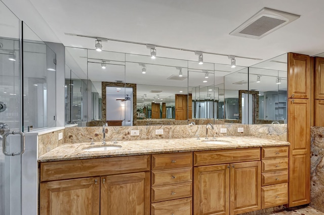 bathroom with vanity and an enclosed shower