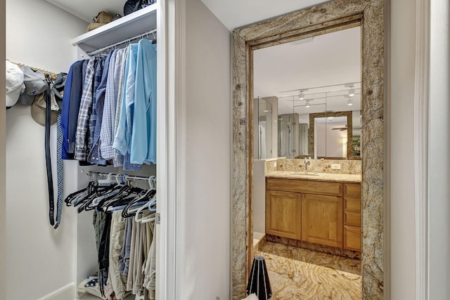 walk in closet featuring sink