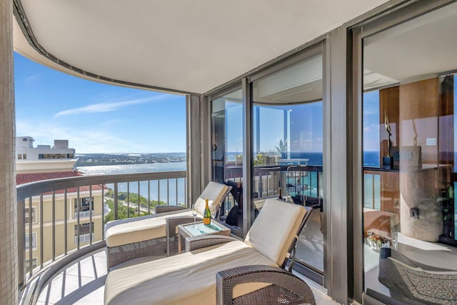 balcony featuring a water view