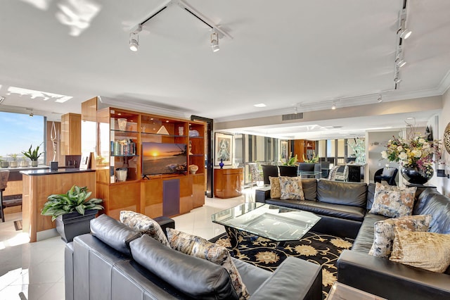 living room featuring light tile patterned floors and ornamental molding