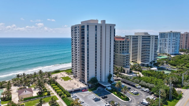 bird's eye view with a water view and a view of the beach