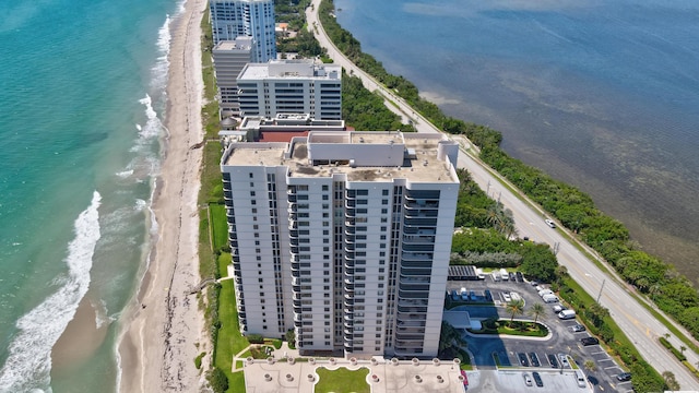 aerial view featuring a water view and a beach view