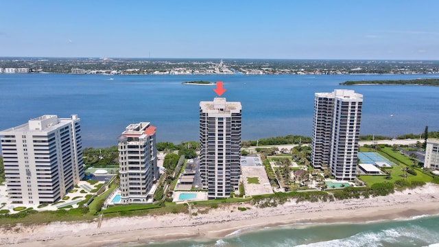 aerial view featuring a view of the beach and a water view