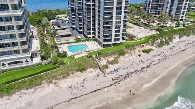 drone / aerial view with a view of the beach and a water view