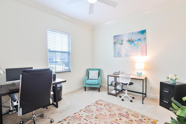 carpeted home office with ceiling fan, crown molding, and baseboards