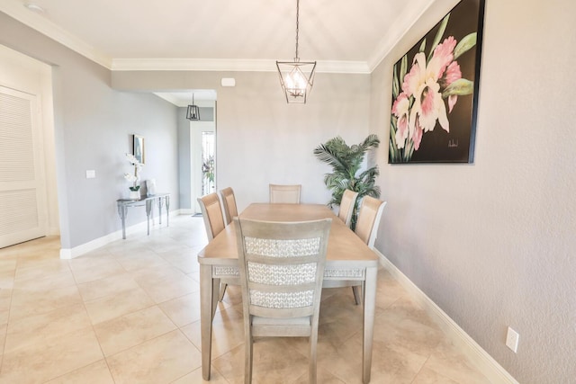 dining area featuring light tile patterned floors, baseboards, an inviting chandelier, and crown molding