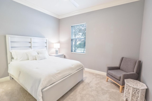 bedroom with light carpet, crown molding, and ceiling fan