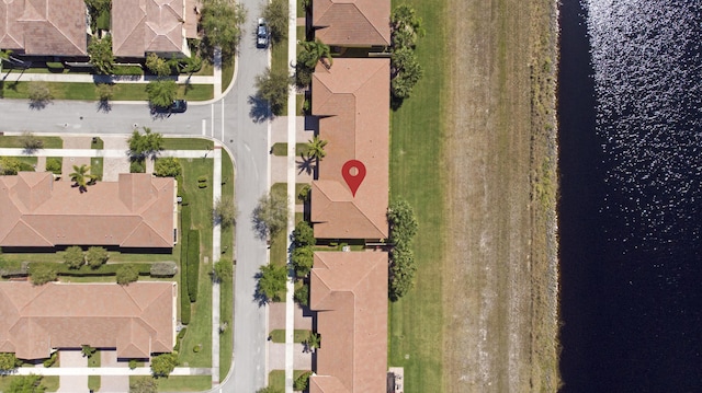 aerial view with a water view and a residential view