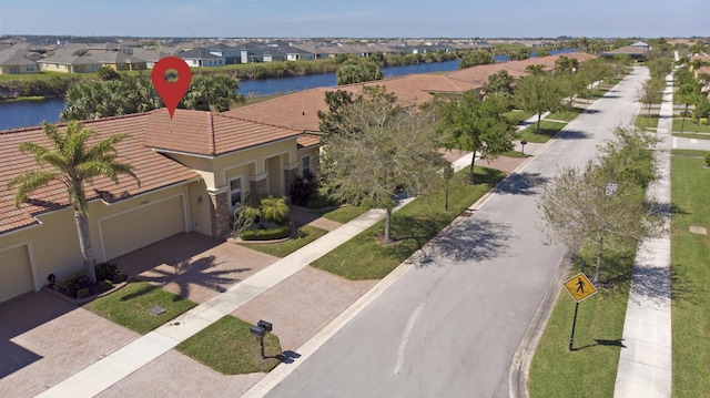 aerial view featuring a residential view and a water view