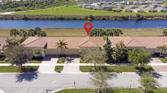 bird's eye view with a residential view and a water view