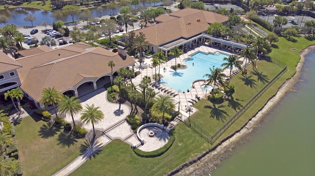 birds eye view of property with a water view