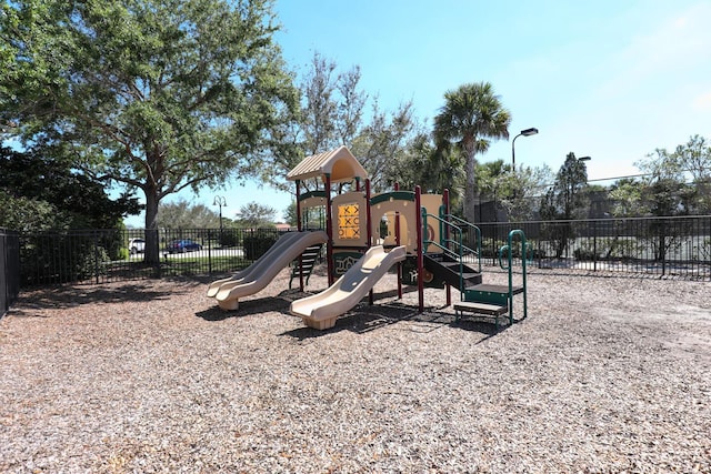 communal playground featuring fence