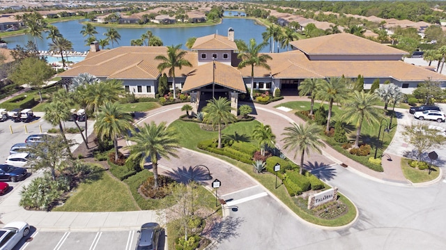 birds eye view of property with a residential view and a water view