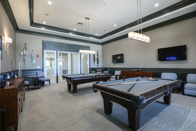 rec room with a wainscoted wall, ornamental molding, a tray ceiling, carpet flooring, and pool table